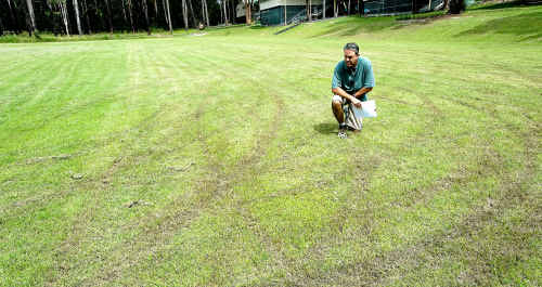 Assistant principal David King inspects the damage. Assistant principal David King inspects the damage.
